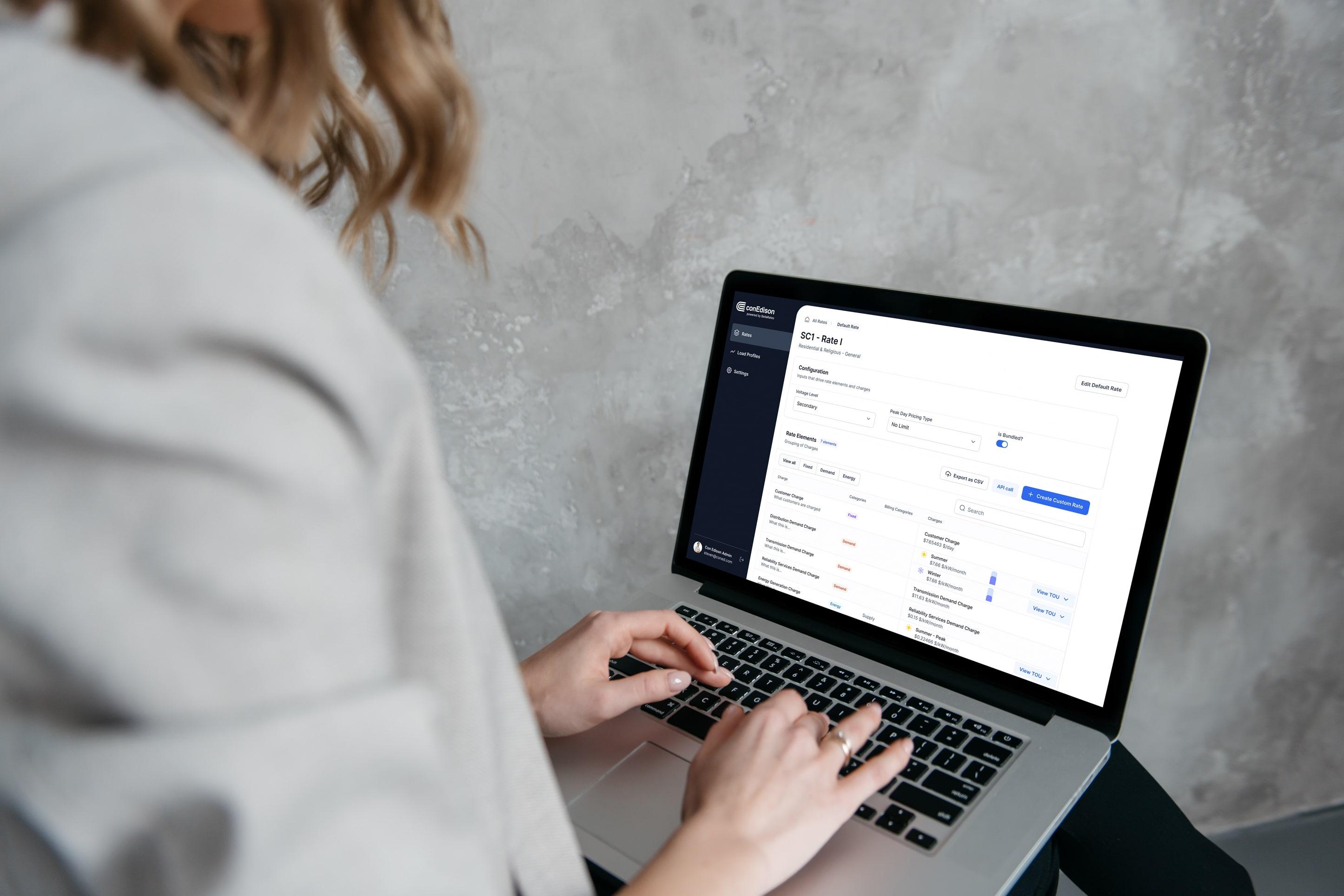 Image of a woman looking at BellaRates on her computer
